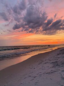 pexels-photo-10036979-10036979-1 Vibrant sunset over Panama City Beach with dramatic skies and serene waves.
